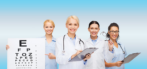 Image showing smiling female eye doctors and nurses