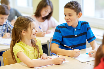 Image showing group of school kids writing test in classroom