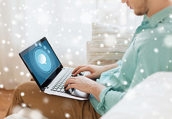 Image showing close up of man working with laptop at home