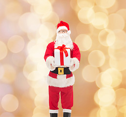 Image showing man in costume of santa claus with gift box