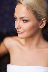 Image showing close up of young woman sitting in bath towel