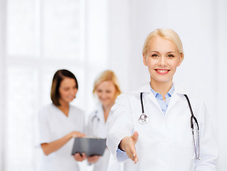 Image showing smiling female doctor with stethoscope