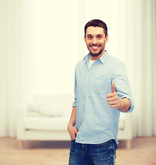 Image showing smiling man showing thumbs up