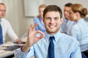 Image showing group of smiling businesspeople meeting in office