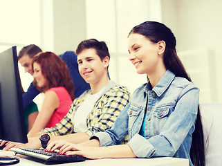 Image showing group of smiling students having discussion