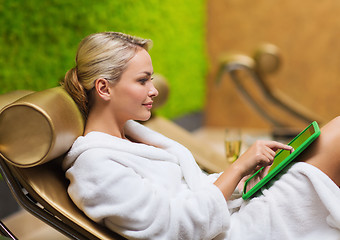 Image showing beautiful young woman with smartphone at spa