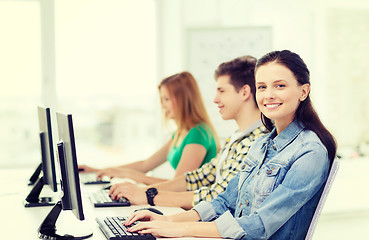 Image showing three smiling students in computer class