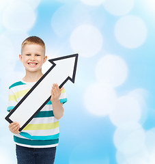 Image showing smiling little boy with blank arrow pointing right