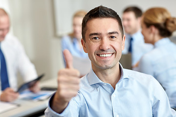 Image showing group of smiling businesspeople meeting in office