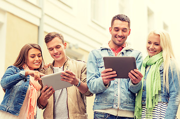 Image showing group of smiling friends with tablet pc computers