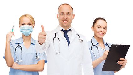 Image showing group of smiling doctors with showing thumbs up