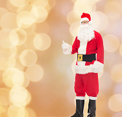 Image showing man in costume of santa claus showing thumbs up