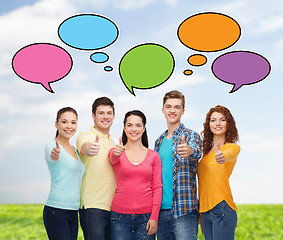 Image showing group of smiling teenagers showing thumbs up