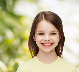 Image showing smiling little girl over white background