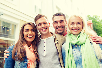 Image showing group of smiling friends in city