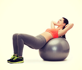 Image showing teenage girl doing exercise on fitness ball