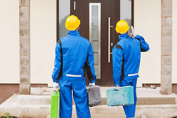 Image showing group of builders with toolboxes