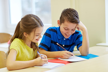 Image showing group of school kids writing test in classroom