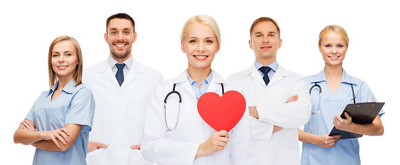 Image showing group of smiling doctors with red heart shape