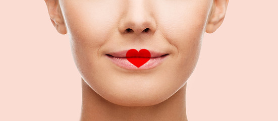 Image showing close up of woman face with heart shape on lips