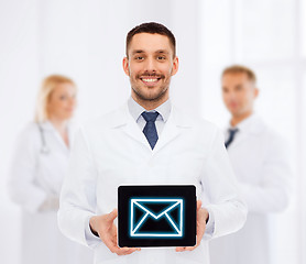 Image showing smiling male doctor with tablet pc