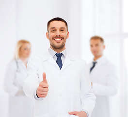 Image showing smiling male doctor showing thumbs up