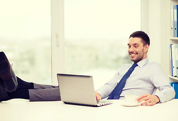 Image showing smiling businessman or student with laptop