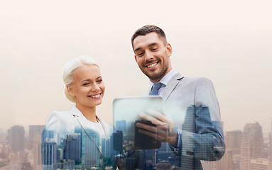 Image showing smiling businessmen with tablet pc in city