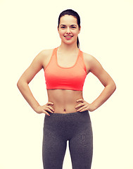 Image showing smiling teenage girl in sportswear