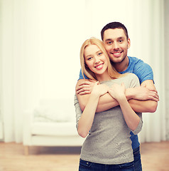 Image showing smiling couple hugging