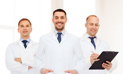 Image showing group of smiling male doctors in white coats