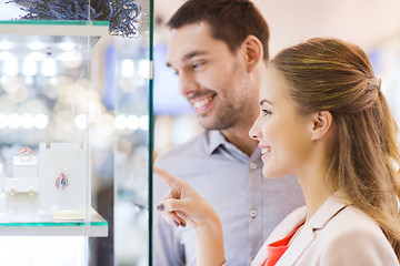 Image showing couple looking to shopping window at jewelry store