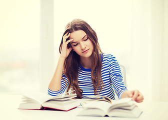 Image showing stressed student girl with books