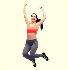 Image showing sporty teenage girl jumping in sportswear