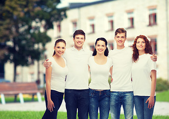 Image showing group of smiling teenagers in white blank t-shirts