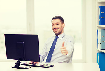 Image showing smiling businessman or student with computer