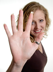 Image showing Woman holding hand up