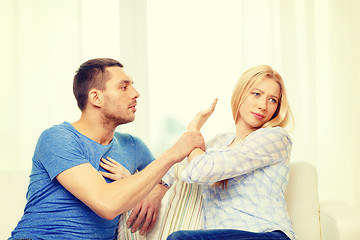 Image showing unhappy couple having argument at home