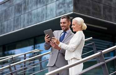 Image showing smiling businessmen with tablet pc outdoors