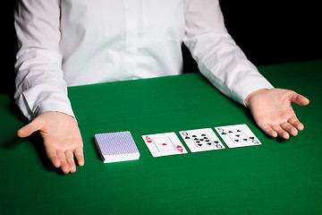 Image showing holdem dealer with playing cards