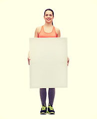 Image showing teenage girl in sportswear with white board