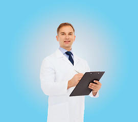 Image showing smiling male doctor with clipboard