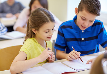 Image showing group of school kids writing test in classroom