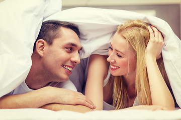 Image showing happy couple sleeping in bed