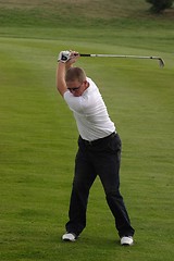 Image showing Male golfer playing golf