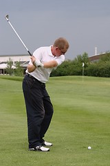 Image showing Male golfer playing golf