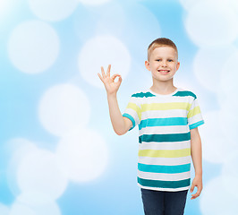 Image showing little boy in casual clothes making OK gesture