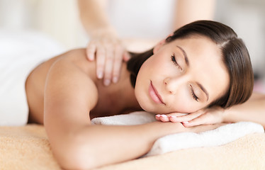 Image showing beautiful woman in spa salon getting massage