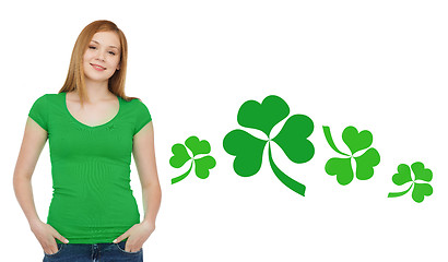 Image showing smiling teen girl in green t-shirt with shamrock