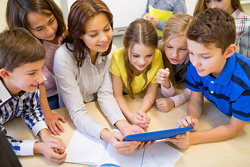 Image showing group of kids with teacher and tablet pc at school